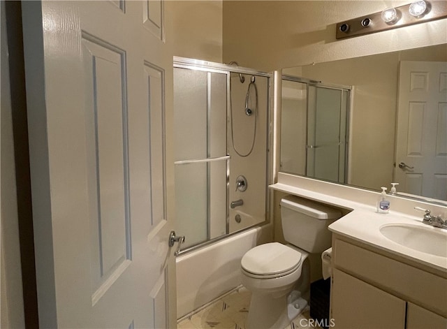 full bathroom with vanity, bath / shower combo with glass door, and toilet
