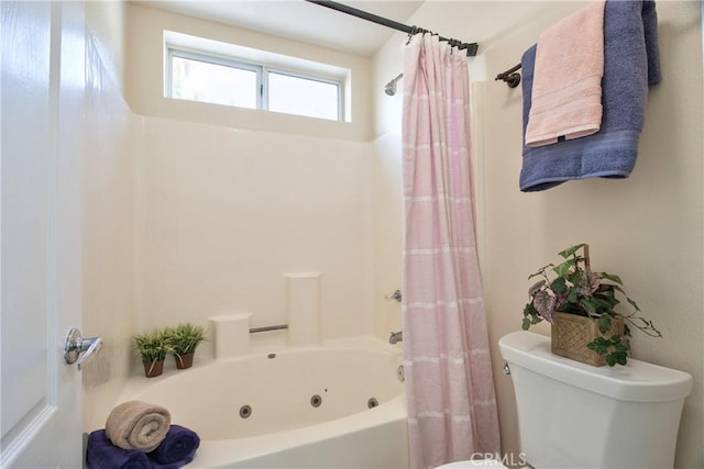 full bath with a combined bath / shower with jetted tub and toilet