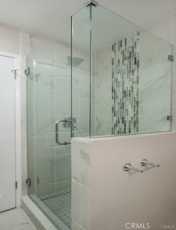 full bath featuring a stall shower