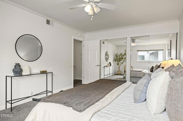 2515 Harbor Blvd Unit 1, Ventura, CA 93001 - carpeted bedroom with two closets, ornamental molding, baseboards, and ceiling fan