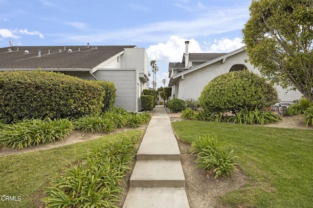 2515 Harbor Blvd Unit 1, Ventura, CA 93001 - view of side of home featuring a lawn and stucco siding