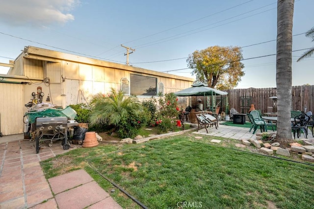 view of yard featuring a patio area and fence