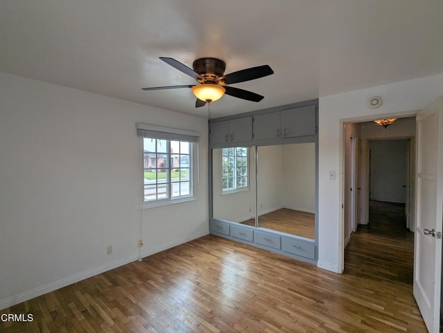 636 N C St, Oxnard, CA 93030 - unfurnished bedroom featuring a closet, wood finished floors, baseboards, and ceiling fan