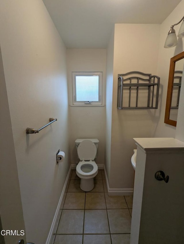 636 N C St, Oxnard, CA 93030 - bathroom with vanity, toilet, baseboards, and tile patterned floors