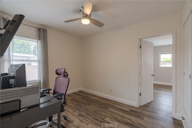 office with baseboards, a ceiling fan, and wood finished floors