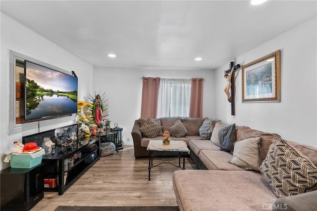 living room featuring recessed lighting and wood finished floors