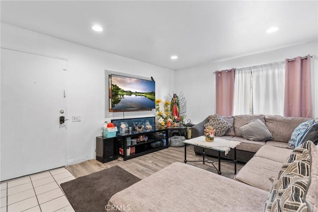 tiled living room with recessed lighting