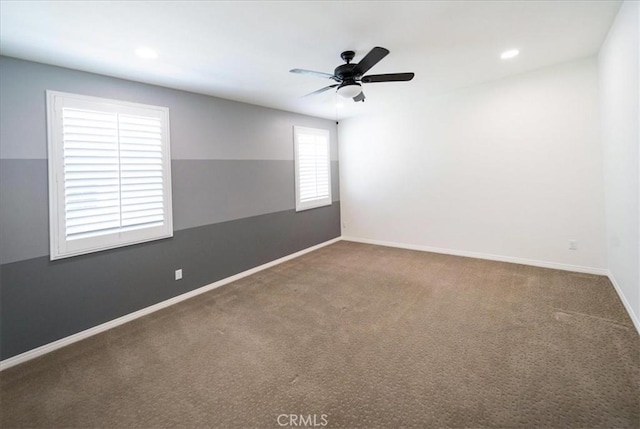 carpeted empty room with baseboards, a ceiling fan, and recessed lighting