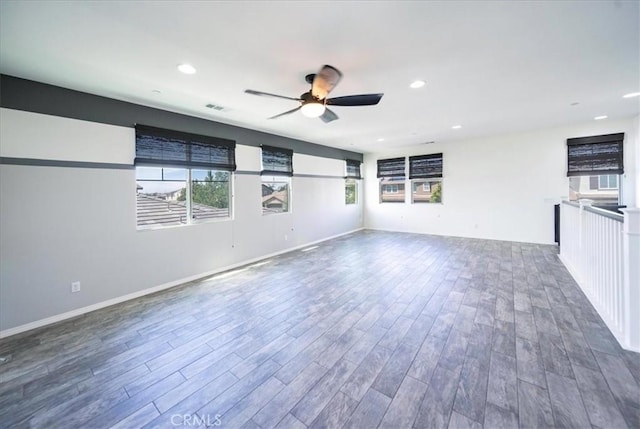 unfurnished living room with recessed lighting, visible vents, a ceiling fan, and wood finished floors