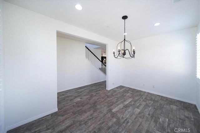 unfurnished dining area with a chandelier, stairs, recessed lighting, and wood finished floors