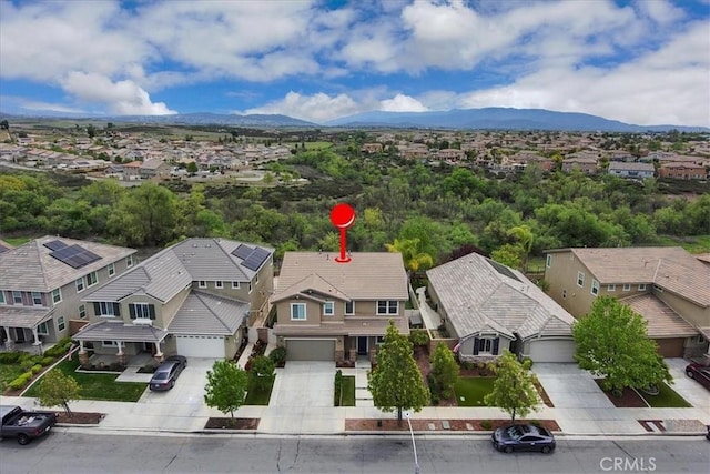 birds eye view of property with a residential view and a mountain view