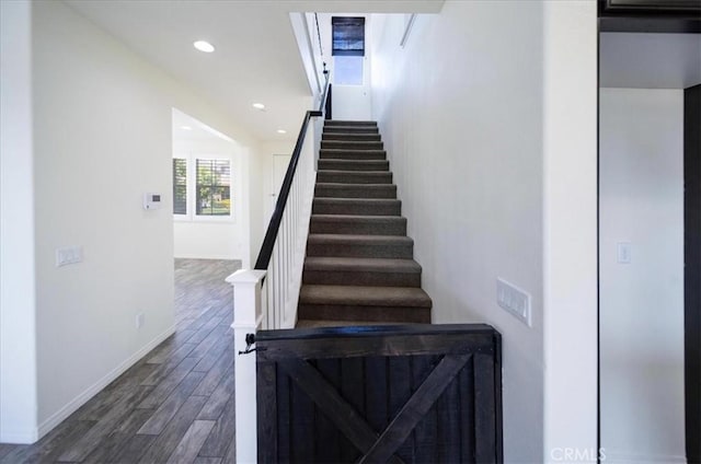 stairs featuring baseboards, recessed lighting, and wood finished floors
