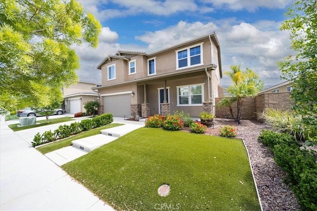 view of front facade featuring a front yard, an attached garage, stone siding, fence, and stucco siding