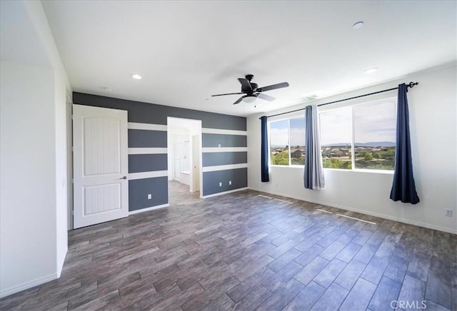 unfurnished bedroom featuring dark wood-type flooring, baseboards, a ceiling fan, and recessed lighting