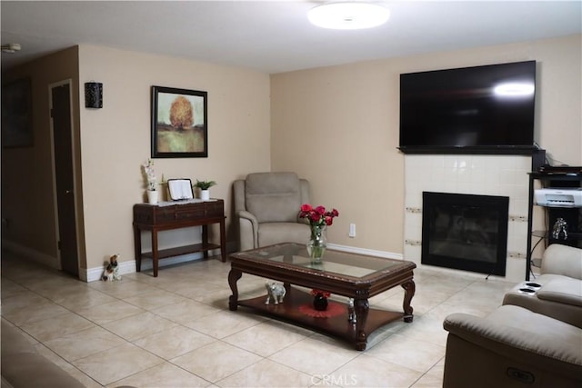 216 Barros St, Patterson, CA 95363 - living room with light tile patterned flooring, a fireplace, and baseboards
