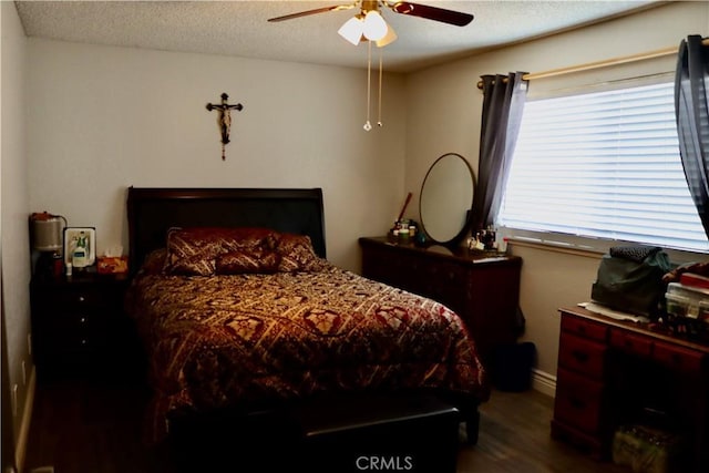 216 Barros St, Patterson, CA 95363 - bedroom featuring baseboards, a textured ceiling, a ceiling fan, and wood finished floors
