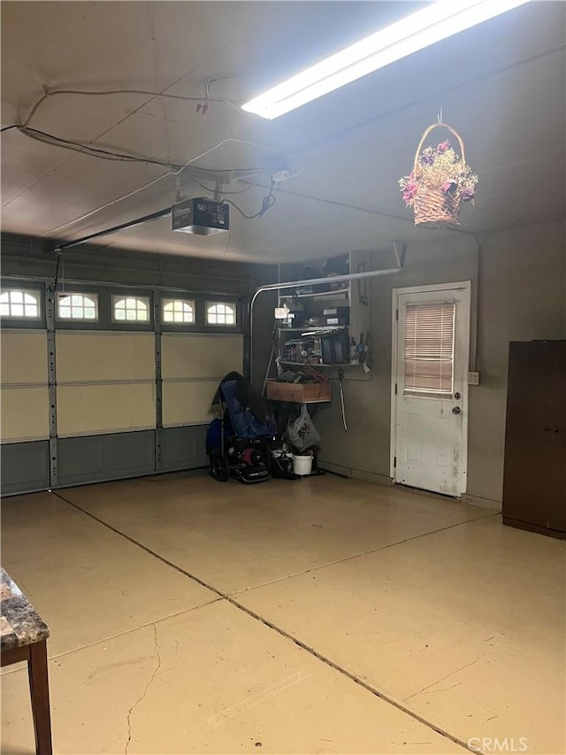216 Barros St, Patterson, CA 95363 - garage featuring a garage door opener