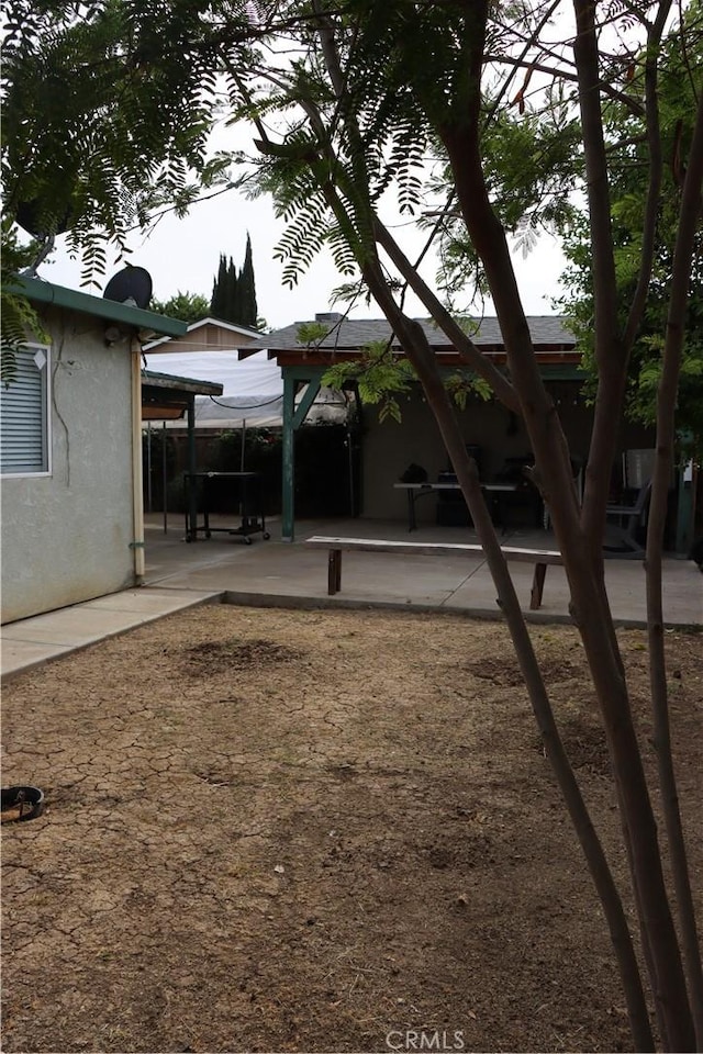 216 Barros St, Patterson, CA 95363 - view of yard featuring a patio area