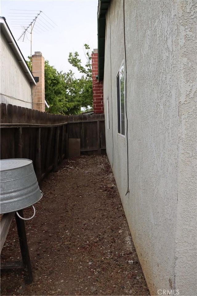 216 Barros St, Patterson, CA 95363 - view of side of home featuring fence and stucco siding