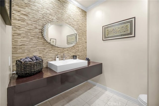 5366 Collingwood Cir, Calabasas, CA 91302 - bathroom featuring tile patterned flooring, toilet, a sink, decorative backsplash, and baseboards