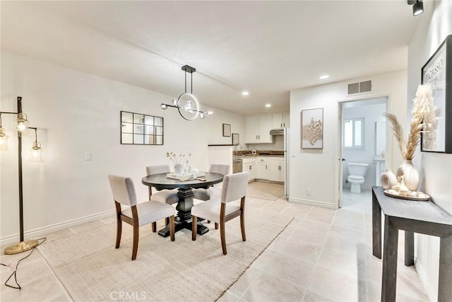 dining space featuring baseboards, visible vents, recessed lighting, a notable chandelier, and light tile patterned floors