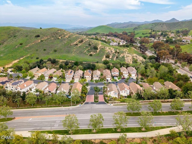 drone / aerial view with a residential view and a mountain view