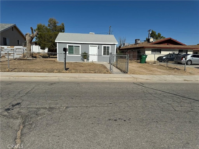 bungalow featuring a gate and a fenced front yard