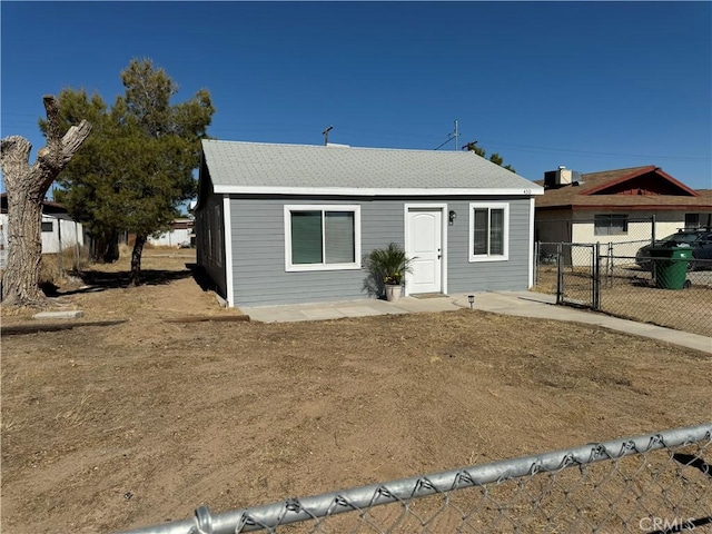 bungalow-style house with a gate and fence