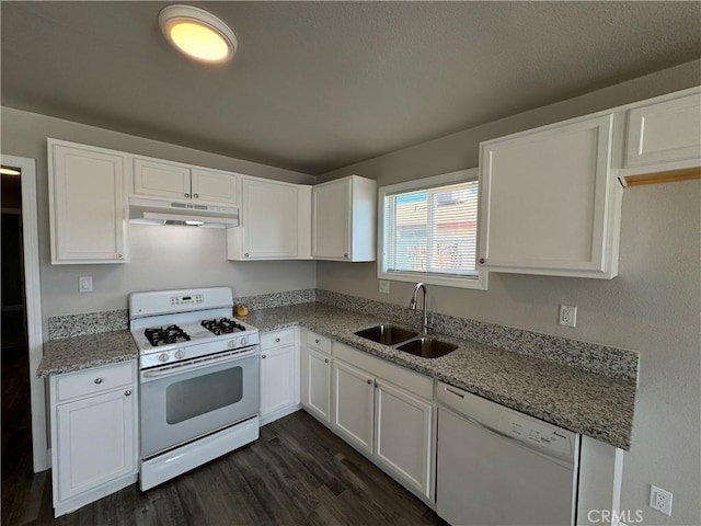 kitchen with white cabinetry, a sink, under cabinet range hood, and white appliances
