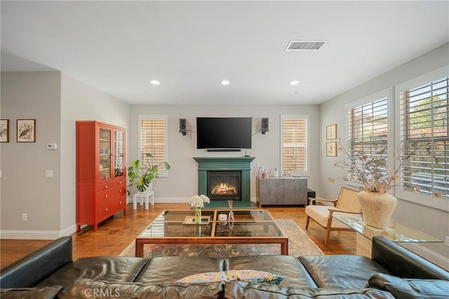 132 Carrotwood, Irvine, CA 92618 - living area with baseboards, wood finished floors, visible vents, and recessed lighting