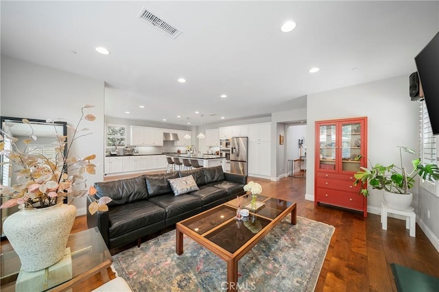 132 Carrotwood, Irvine, CA 92618 - living room featuring recessed lighting, baseboards, visible vents, and dark wood-type flooring
