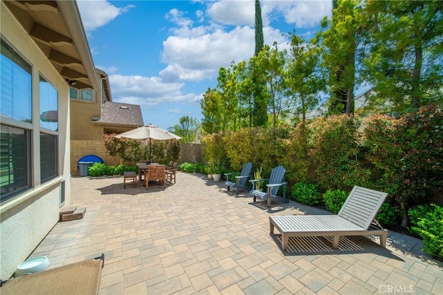 132 Carrotwood, Irvine, CA 92618 - view of patio featuring a fenced backyard and outdoor dining area
