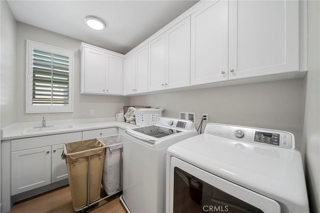 132 Carrotwood, Irvine, CA 92618 - clothes washing area with cabinet space, independent washer and dryer, wood finished floors, and a sink