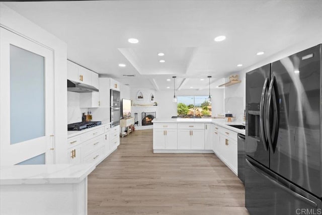 402 Ali Way, Fallbrook, CA 92028 - kitchen with black appliances, under cabinet range hood, a peninsula, recessed lighting, and white cabinetry