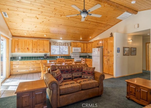 living area featuring vaulted ceiling with beams, wooden ceiling, and a ceiling fan