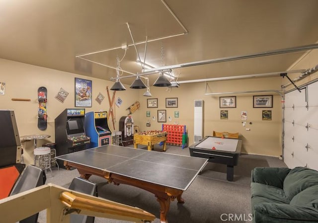game room featuring a garage and carpet floors