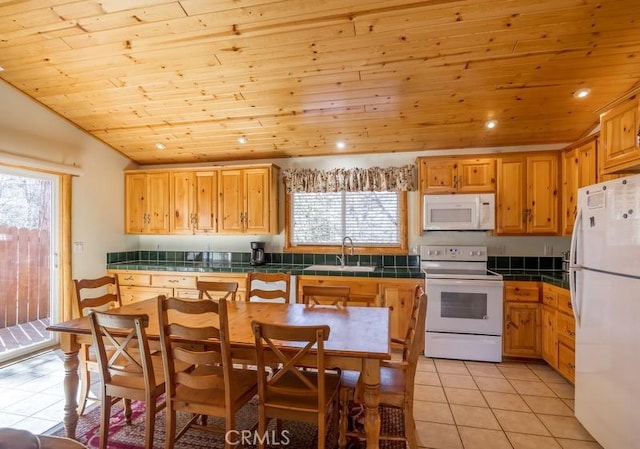 kitchen with wood ceiling, white appliances, and plenty of natural light