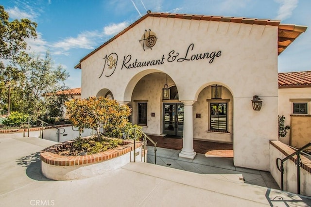 5367 Algarrobo Unit C, Laguna Woods, CA 92637 - view of front of house featuring french doors, a tile roof, and stucco siding