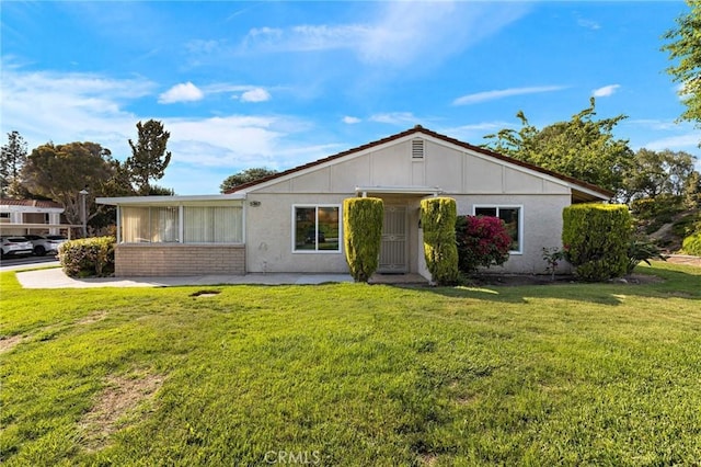 5367 Algarrobo Unit C, Laguna Woods, CA 92637 - ranch-style house featuring a front lawn, brick siding, and stucco siding