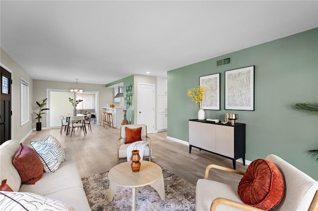 5367 Algarrobo Unit C, Laguna Woods, CA 92637 - living room featuring a chandelier, light wood-style flooring, recessed lighting, and baseboards
