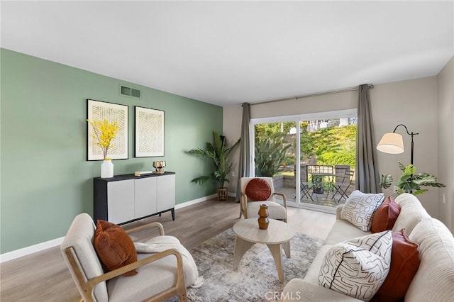 5367 Algarrobo Unit C, Laguna Woods, CA 92637 - living room featuring baseboards and wood finished floors