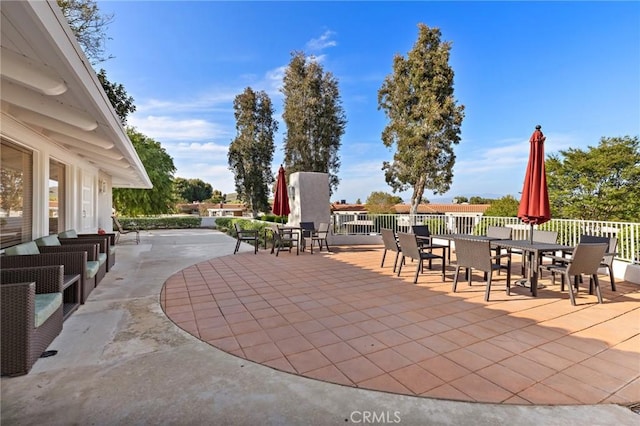 view of patio featuring fence and outdoor dining space