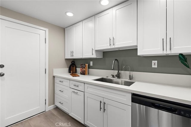 5367 Algarrobo Unit C, Laguna Woods, CA 92637 - kitchen with dishwasher, a sink, white cabinets, recessed lighting, and light countertops