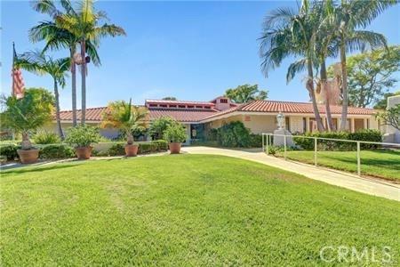 5367 Algarrobo Unit C, Laguna Woods, CA 92637 - view of front of property featuring a front yard and a tile roof
