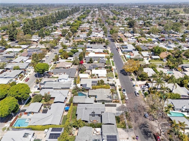 birds eye view of property with a residential view