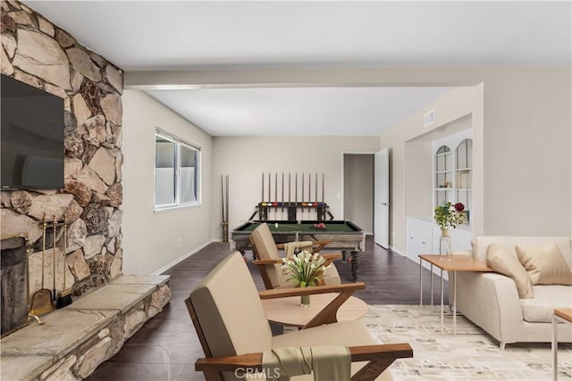 6304 Tamarind St, Oak Park, CA 91377 - living room with billiards, wood finished floors, visible vents, and a fireplace