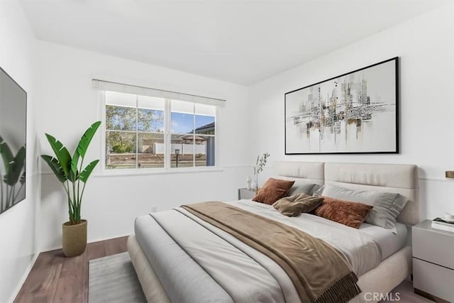 6304 Tamarind St, Oak Park, CA 91377 - bedroom with baseboards and wood finished floors