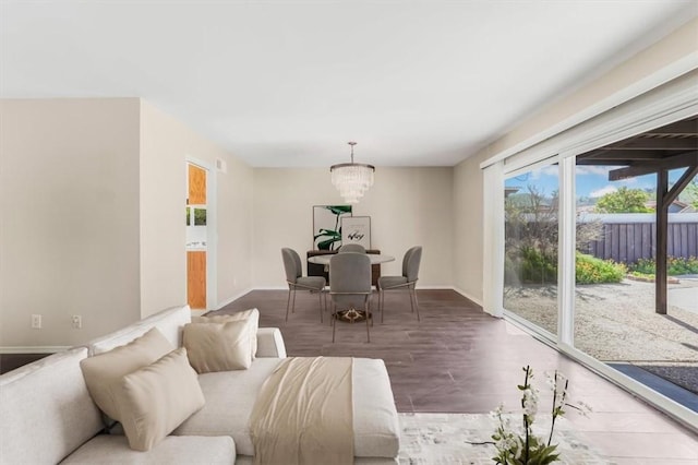 6304 Tamarind St, Oak Park, CA 91377 - living area featuring baseboards, a chandelier, and wood finished floors