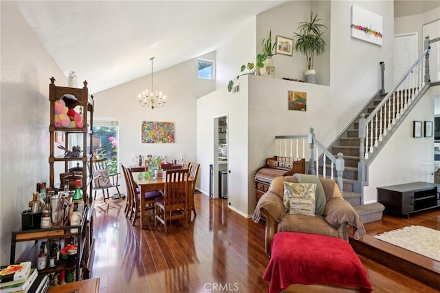 312 Barrington Cir, Redlands, CA 92374 - dining space with wood-type flooring, stairway, a chandelier, and high vaulted ceiling