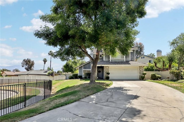 312 Barrington Cir, Redlands, CA 92374 - view of front of house with stone siding, concrete driveway, and an attached garage